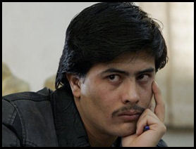   Parwez Kambakhsh listens to allegations against him at his trial in Kabul, Afghanistan, on Tuesday. 