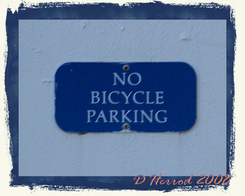 Here is the sign posted below the drain. Now who would park their bike in here?