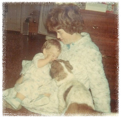 Polly is trying to wake me up.  Yes, I'm the little one sitting in my mom's lap.