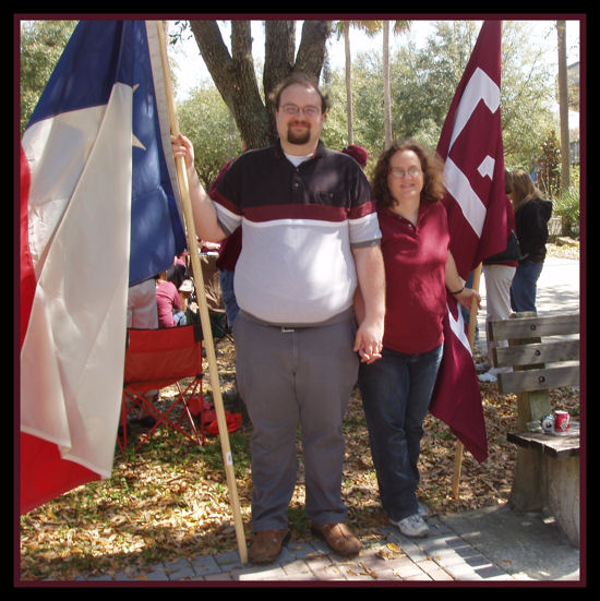 The Big Guy and I flanked by the Texas & A&M flags.
